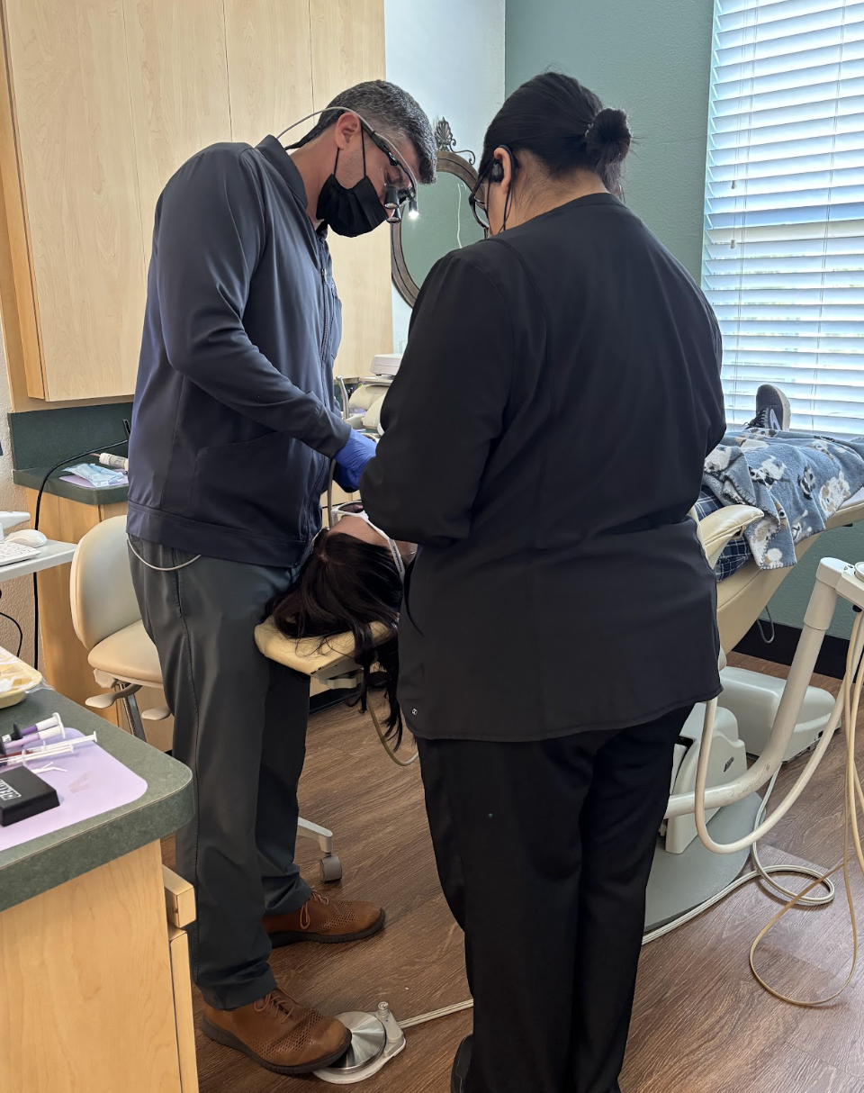 picture of dentist in saginaw with patient in treatment